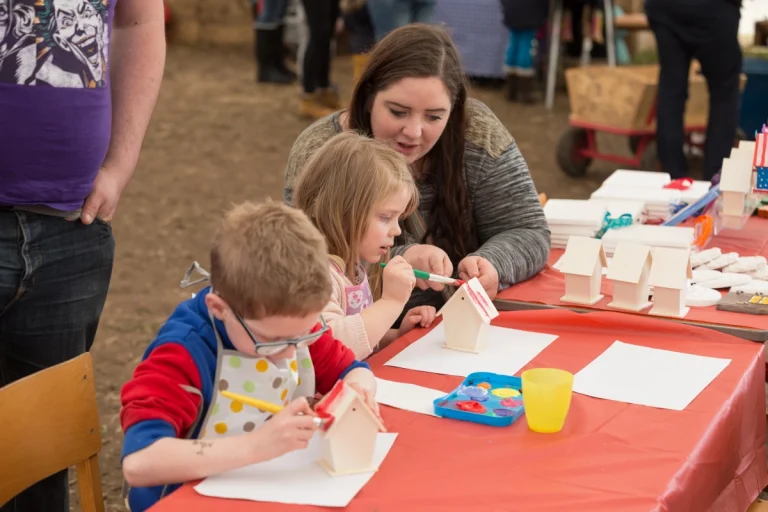 Children crafting at a table