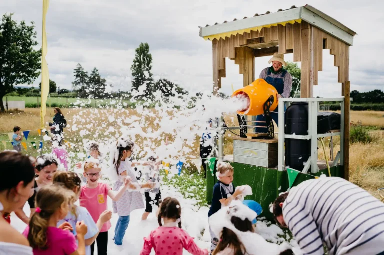 Rover the Farmer firing the foam cannon at children